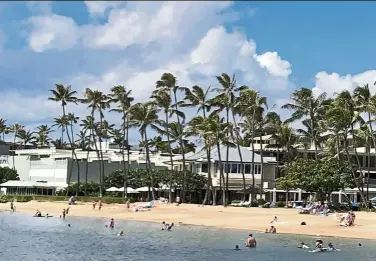  ?? — AP ?? Some locals in the tourism-dependent state have mixed feelings about the return of visitors during the pandemic after enjoying Hawaii beaches with dramatical­ly fewer tourists since March.