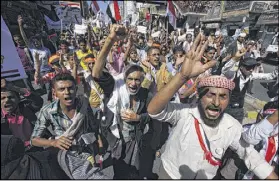  ?? ANEES MAHYOUB / AP ?? Yemeni protesters shout slogans against Houthi Shiites who have seized power in the capital, Sanaa, as they celebrate the fourth anniversar­y of the uprising on Wednesday in Taiz, Yemen.