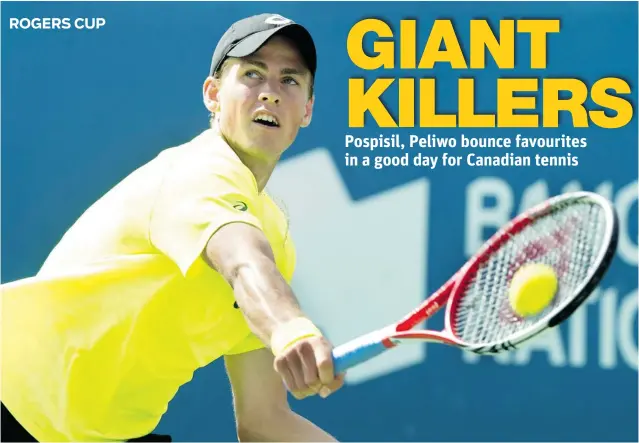  ?? PAUL CHIASSON/ THE CANADIAN PRESS ?? Vasek Pospisil of Vancouver returns a shot to John Isner of the U. S. during Tuesday’s fi rst round of singles action at the Rogers Cup tennis tournament in Montreal. Pospisil won 5- 7, 7- 6 ( 5), 7- 6 ( 4).