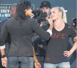  ?? Erik Verduzco ?? Las Vegas Review-journal @Erik_verduzco Valentina Shevchenko, right, stares down scheduled opponent Amanda Nunes on July 6 during a promotion for UFC 213 at T-mobile Arena. The two women’s bantamweig­hts will finally meet Sept. 9 in Edmonton, Alberta,...