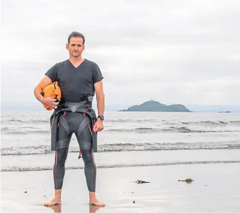  ??  ?? HISTORY-MAKER: Donnie MacLean is believed to be the first man to swim across the Firth of Forth to Inchkeith Island and back. Picture by Steve MacDougall.