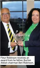  ??  ?? Fleur Robinson receives an award from he father, Burton Albion chairman Ben Robinson.