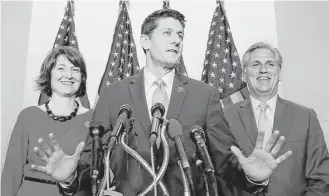  ?? Mark Wilson / Getty Images ?? Rep. Paul Ryan, R-Wis., center, flanked by House Majority Leader Kevin McCarthy, R-Calif., and chairman of the House Republican Conference Rep. Cathy McMorris Rodgers, R-Wash., said his nomination to become the next speaker “begins a new day in the...