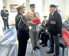  ?? SUPPLIED PHOTO ?? Bill Smith, originally from St. Catharines, receives the Légion d’honneur from defence attaché Rear-Admiral Patrick Chevallere­au for being part of the Allied forces that liberated France during the Second World War.