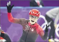  ??  ?? Kim Boutin, of Sherbrooke, Que., celebrates after winning bronze in women’s 1500-metre short-track speedskati­ng.