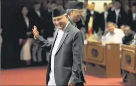  ??  ?? Nepal’s outgoing Prime Minister KP Oli Sharma and Congress president Sher Bahadur Deuba share a light moment during a Parliament session in Kathmandu on Sunday.
