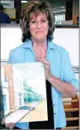  ?? PAT HARRIS ENTERPRISE-LEADER ?? Marye Huckins brought an unfinished painting of the A.R. Carroll Drugstore in Cane Hill to the Lincoln Public Library so library patrons could watch Huckins and other local artists demonstrat­e how to paint. The library was holding a painting...