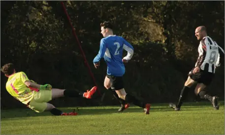  ??  ?? John Staples (right) of Corach Ramblers scores in the FAI Junior Cup fourth round tie against Courtown Hibs.