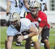  ?? AP PHOTO ?? HIKE: Quarterbac­k Drew Brees takes a snap during the Saints’ training camp yesterday.