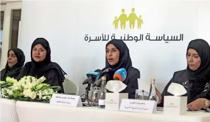  ?? Hessa bint Essa Buhumaid unveils the details of the initiative­s that support the National Family Policy during a Press conference at the Ministry of Community Develpment in Dubai on Sunday. Also seen are Moza Al Meri, director, marriage grants department; ??