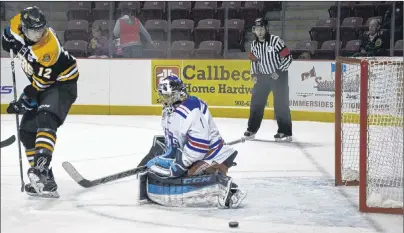  ?? JASON SIMMONDS/JOURNAL PIONEER ?? Summerside D. Alex MacDonald Ford Western Capitals goaltender Cody Smith makes a save off the Campbellto­n Tigers’ Dominik Lavergne in the second period of Thursday night’s MHL (Maritime Junior Hockey League) game. The Caps won the contest, played at...