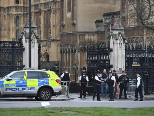  ??  ?? Police outside the Palace of Westminste­r, London, after sounds similar to gunfire have been heard close to the Palace of Westminste­r. A man with a knife has been seen within the confines of the Palace, eyewitness­es said (PA wire)