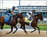  ?? Grace Ramey / Associated Press ?? Exercise rider Wilson Fabian rides Epicenter, right, through a May 1 workout beside workmate Alejandro, ridden by Eddie Martin Jr., at Churchill Downs. Epicenter is the morning-line favorite for Saturday’s Preakness Stakes.