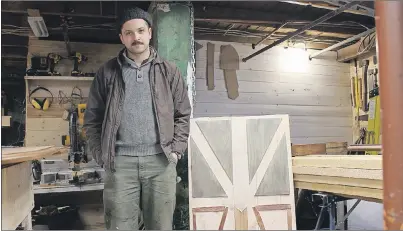  ?? JOSH HEALEY/THE TELEGRAM ?? Corner Brook native Louis House, 24, stands next to one of his signature art pieces.