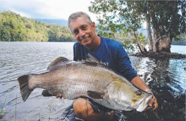  ??  ?? PRIZED SPECIES: Copperlode Dam Fishing and Kayak operator Kim Andersen with a large barramundi caught in Copperlode Dam.