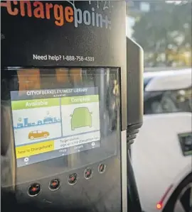  ?? Josh Edelson For the Times ?? AN ELECTRIC vehicle charging station in Berkeley. Voters rejected Prop. 30, a plan to raise taxes on wealthy residents to subsidize the purchase of electric cars.