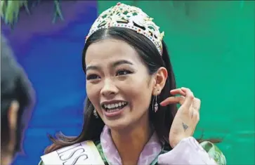  ?? Namgay Wangchuk AFP/Getty Images ?? TASHI CHODEN CHOMBAL, crowned Miss Bhutan this year, attends a June LGBTQ pride event in Thimphu. She came out to friends on social media when she was 15, and a few months ago told her family she is gay.