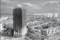  ?? AP/KIRSTY WIGGLESWOR­TH ?? The charred remains of Grenfell Tower are seen Saturday.