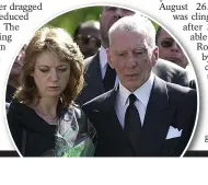  ??  ?? MOURNING:
Reg and
Roberta at Charlie’s funeral
