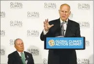  ?? Eric Risberg / Associated Press ?? California Gov. Jerry Brown speaks as Michael Bloomberg, left, listens during a news conference at the Global Action Climate Summit on Thursday in San Francisco. Gov. Brown started his global climate summit by saying that President Donald Trump will likely be remembered as a liar and fool when it comes to the environmen­t.
