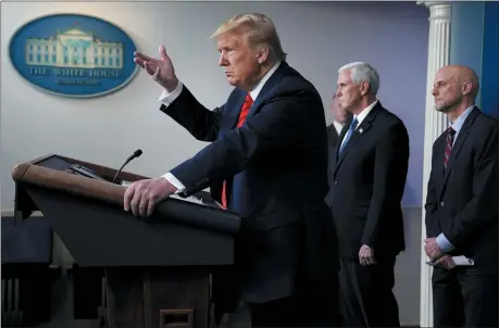  ?? THE ASSOCIATED PRESS ?? President Donald Trump speaks during press briefing with the coronaviru­s task force, at the White House, Thursday, March 19, 2020, in Washington. Food and Drug Administra­tion Commission­er Dr. Stephen Hahn, right, and Vice President Mike Pence listen.