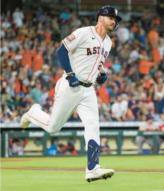  ?? BOB LEVEY/GETTY ?? Trey Mancini runs the bases after hitting a two-run home run in the second inning Wednesday for his new team, the Astros, against the Boston Red Soxat Minute Maid Park in Houston.