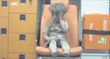  ??  ?? This image of Omran Daqneesh, 5, was taken after he was pulled from the ruins of his home in Aleppo, where numerous children have died.