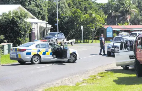  ??  ?? A police roadblock in Takahe Rd, Ahipara, where shots were fired at a property yesterday.