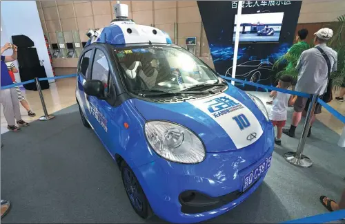 ?? LI SHENGLI / FOR CHINA DAILY ?? Baidu Inc’s autonomous car at an exhibition in Tianjin. The internet company is pushing forward the research and developmen­t of autonomous driving technology.