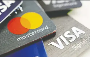  ?? DANIEL ACKER/ BLOOMBERG ?? Visa and Mastercard are reviewing their financial ties to Pornhub amid claims its videos showed child abuse and assault. Pornhub's Luxembourg-based owner Mindgeek was founded in Montreal.