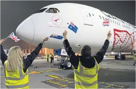  ??  ?? Non-stop Qantas Dreamliner gets a warm Heathrow welcome yesterday