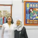  ??  ?? Textile artist Mariam Moussa (right) and her daughter in front of her textile artwork.