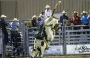  ?? Courtesy photo ?? Bullrider Nathan Hatchel hangs on to his bull.