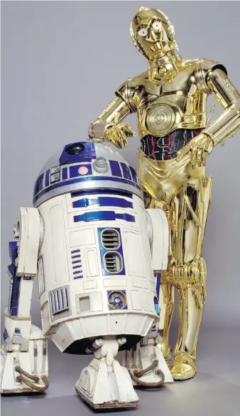  ?? PHOTOS: THE DETROIT INSTITUTE OF ARTS ?? Props used to portray the Star Wars droid characters R2-D2 and C-3PO are part of the exhibition Star Wars and the Power of Costume, which runs at the Detroit Institute of Arts from May 20 to Sept. 30. Also in the exhibition is a Yoda puppet used in the...