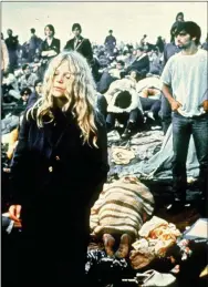  ?? AP FILE PHOTO ?? In this August 1969 file photo, rock music fans listen to performers at the Woodstock Festival of Arts and Music in Bethel, N.Y.