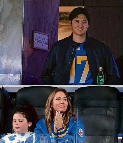  ?? KEVORK DJANSEZIAN/GETTY IMAGES ?? The $700 million man, Shohei Ohtani of the Dodgers, is making the rounds in Los Angeles, looking on during the first quarter of the Saints-Rams game at SoFi Stadium Thursday night.