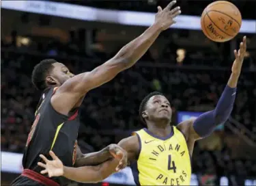  ?? TONY DEJAK — THE ASSOCIATED PRESS ?? Cleveland Cavaliers’ Jeff Green, left, and Indiana Pacers’ Victor Oladipo (4) battle for a rebound in the first half of Game 1 of an NBA basketball first-round playoff series Sunday in Cleveland.