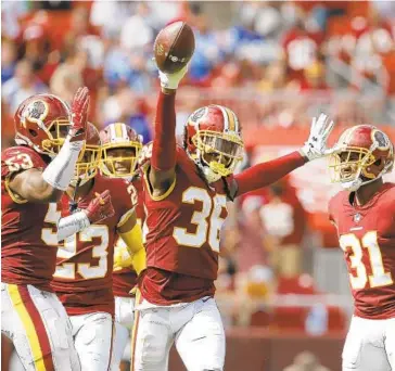  ?? CAROLYN KASTER/ASSOCIATED PRESS ?? Redskins safety D.J. Swearinger (36), celebratin­g an intercepti­on, isn’t too pleased with the NFL’s new emphasis on roughing the passer calls. He called the penalties a “horrible rule” and said the calls were unfair to defensive players.