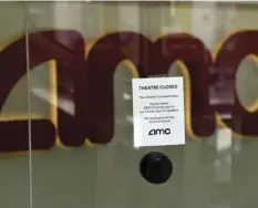  ?? AP PHOTO/CHRIS PIZZELLO ?? In this April 29 file photo, a message on the ticket window at the AMC Burbank 16 movie theaters complex informs potential customers that it is currently closed in Burbank, Calif.