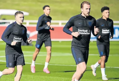  ?? Picture: AFP/PAUL ELLIS ?? A UNITED FRONT: From left, England's Kieran Trippier, Trent Alexander-Arnold, Harry Kane and Jadon Sancho warm up during an open training session at St George's Park in Burton-on-Trent on Tuesday ahead of their Uefa Nations League match against Croatia on Friday.