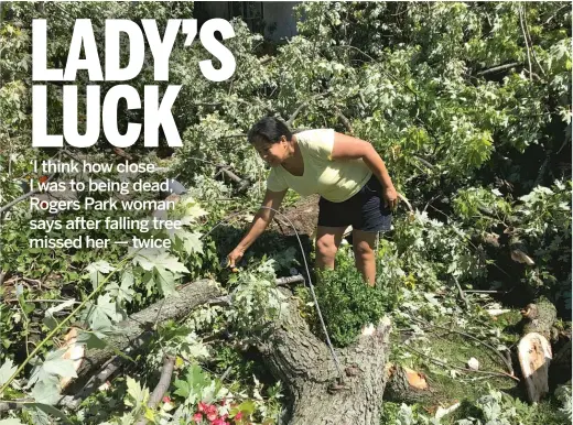  ?? MITCH DUDEK/SUN-TIMES PHOTOS ?? Mirella Morena was using her garden hose moments before a neighbor’s tree fell where she was standing.