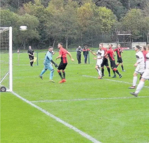  ??  ?? Luke Gullick crashes a header against the bar