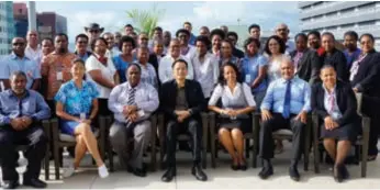  ??  ?? China focus … Dr Marcus Lee (front row, fourth from left) with Air Niugini staff and participan­ts of the China workshop in Port Moresby recently.