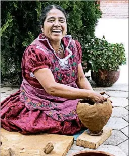  ??  ?? Macrina Mateo Martinez, who lives in San Marcos Tlapazola, has become well known for her red pottery, a Zapotec craft she learned from her ancestors.