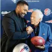  ?? Steven Senne/Associated Press ?? Newly-named Patriots head coach Jerod Mayo, left, and Patriots owner Robert Kraft shake hands Wednesday following a news conference.