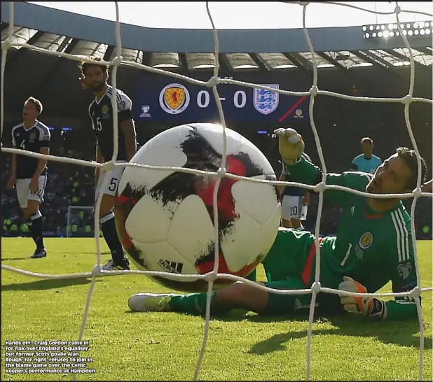  ??  ?? Hands off...Craig Gordon came in for flak over England’s equaliser but former Scots goalie Alan Rough, far right, refuses to join in the blame game over the Celtic keeper’s performanc­e at Hampden