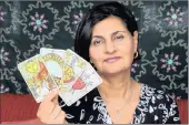  ?? PICTURE: JACQUES NAUDE ?? LOOKING AHEAD: Durban tarot card reader Minaxie Gihwala, known as MG, casts a look at what’s in store for 2017.