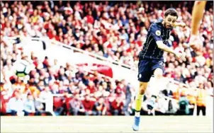  ?? AFP ?? Manchester City midfielder Bernardo Silva scores his side’s second goal in their English Premier League match with Arsenal at the Emirates Stadium in London on Sunday.