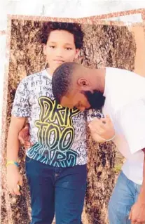  ?? FILE ?? Carlos Hunter Jr., 11, and Carlos Hunter Sr., 33, were hit by a driver on East Hallandale Beach Boulevard on June 12. Hunter Jr. was killed, along with the driver of a disabled Jeep he and his father were helping.