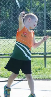  ??  ?? Left: Toby McMillan shows his style in the discus; Photograph­s: Paul Cohen.